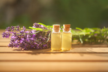 lavender essential oil in  beautiful bottle on table