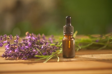 lavender essential oil in  beautiful bottle on table