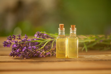 lavender essential oil in  beautiful bottle on table