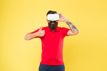 Naklejka premium Virtual reality is like dreaming with your eyes open. Impressive experience. Man play game in VR glasses. Hipster with virtual reality headset. Virtual communication concept. Virtual simulation