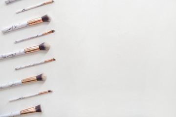 Set of makeup brushes on white background