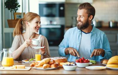 family happy couple have Breakfast in kitchen in morning.