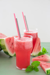 Glass of fresh watermelon juice on table