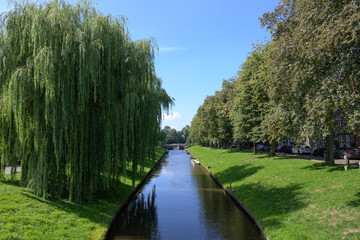 Gracht or canal in Friedrichstadt, the beautiful town and travel destination in northern Germany founded by Dutch settlers, copy space