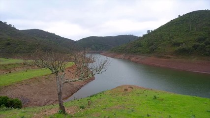 Aerial. Flying drone in fog and clouds over the hills in Monchique Portugal.