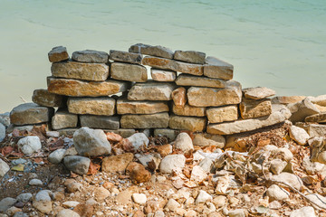 Fragment of a wall with masonry