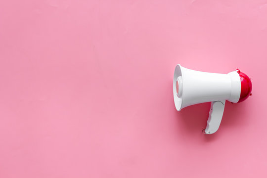 megaphone for advertising and announcement on pink background top view copyspace
