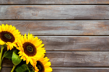 Field flowers design with sunflowers on wooden background top view space for text