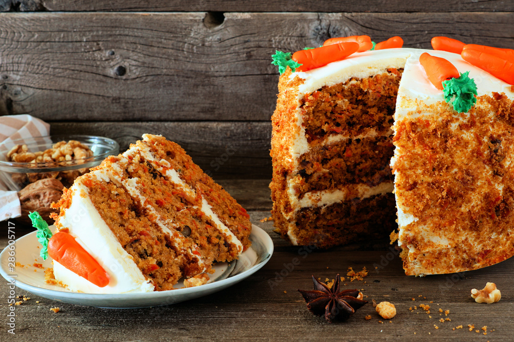 Poster slice of homemade carrot cake with cream cheese frosting and fondant carrots. side view table scene 