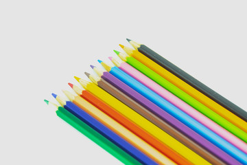 crayons on white background table.