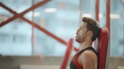 thletic sport trainer practicing exercises with dumbbell in sport club.