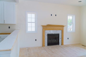 Empty spacious living room with fireplace new apartment