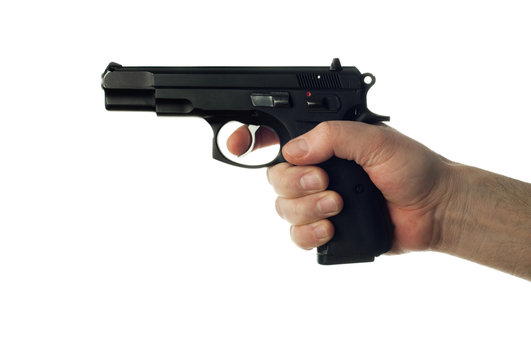 Hand holding gun on white background