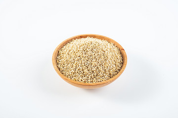 A wooden bowl of miscellaneous grains buckwheat on a white background