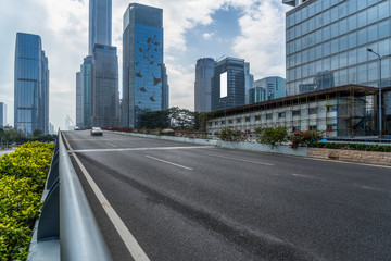 Empty urban road and modern skyline.