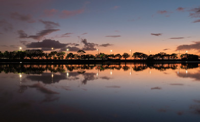 summer sunset on the lake with clouds reflection