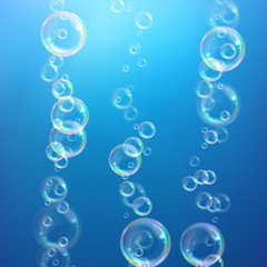 Realistic transparent floating soap bubbles with rainbow reflection. Design element for advertising booklet, flyer or poster