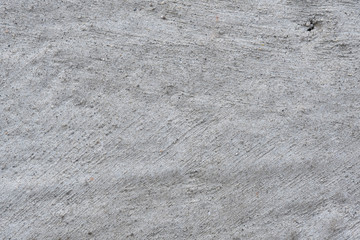 Concrete wall for background. Rough texture, bumps.