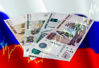 Russian ruble with growth schedule Russian rubles on a colored background. Banknotes of Russian...