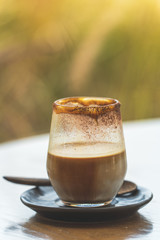 cup of coffee on wooden table