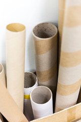 Postal tubes stacked together ready for sending.