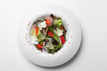 Greek strawberry salad on a white background