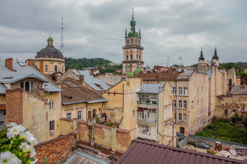 Obraz premium Lviv, Ukraine - August 13, 2019: View of the roofs and old houses in the central part of Lviv