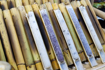 "Khao Lam" is sticky rice soaked in coconut milk and baked in a length of bamboo. Thai dessert.