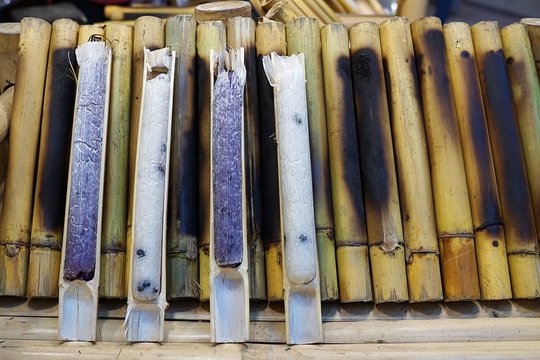 "Khao Lam" is sticky rice soaked in coconut milk and baked in a length of bamboo. Thai dessert.