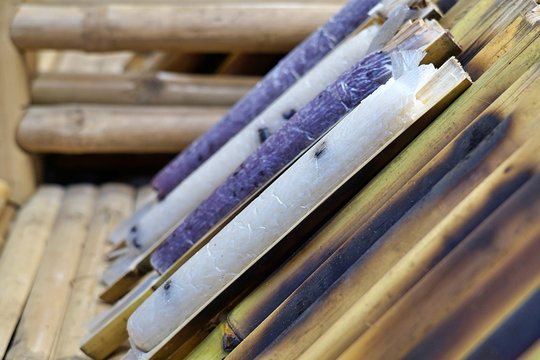 "Khao Lam" is sticky rice soaked in coconut milk and baked in a length of bamboo. Thai dessert.