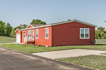 Fototapeta na wymiar Manufactured Home with Red Siding