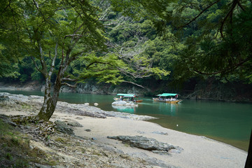 Katsura River,Kyoto,Japan - July 7,2019 : Tourists on the boats in the Katsura river