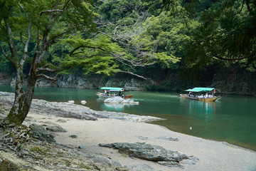 Katsura River,Kyoto,Japan - July 7,2019 : Tourists on the boats in the Katsura river
