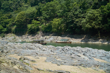 Katsura River,Kyoto,Japan - July 7,2019 : Tourists on the boats in the Katsura river