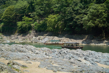 Katsura River,Kyoto,Japan - July 7,2019 : Tourists on the boats in the Katsura river
