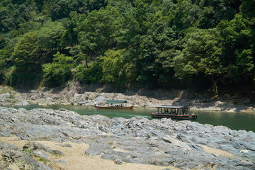 Katsura River,Kyoto,Japan - July 7,2019 : Tourists on the boats in the Katsura river