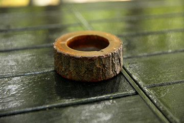 Wooden ashtray on the wooden table