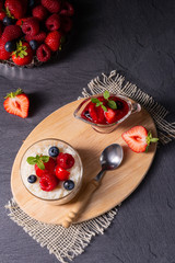delicious milk rice with different berries and red fruit jelly