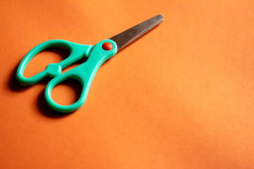 small scissor on plain background