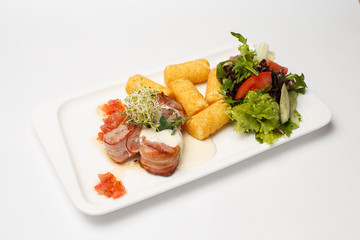 sauce medallions with cheese sticks and a vegetables