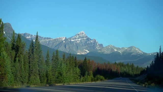 Driving Along The Icefields Parkway, Alberta Canada. Shot From Inside A Car