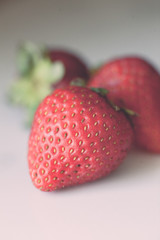 Strawberries on white marble counter top