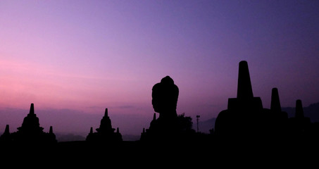 Fototapeta premium Natural amazing sunrise view at Borobudur Buddhist temple, great religious architecture in Magelang, Central Java, Indonesia.