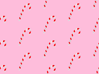 Seamless watercolor pattern with sweet candy cane sticks. New year festive background. Template for fabric or wrapping paper print. Hand drawn illustration. Christmas decoration food objects.