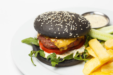 black burger with pork chop cheese and a arugula