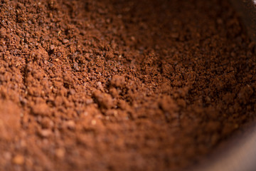 Coffee beans are ground into coffee powder by a grinder．