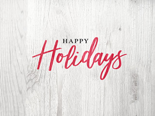 Happy Holidays Calligraphy Red Christmas Text Over White Rustic Wood Background