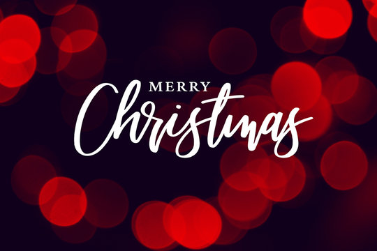 Merry Christmas Calligraphy with Red Holiday Bokeh Lights Background