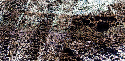 Traces of a car on dirty soil