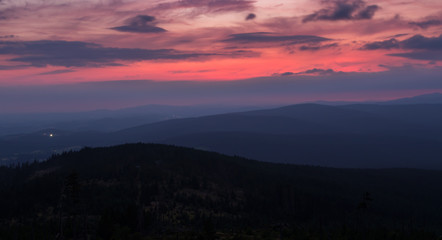 Fototapeta na wymiar Sunset with distant hill from Tristolicnik. Blue hour. Sumava National Park and Bavarian Forest, Czech republic and Germany
